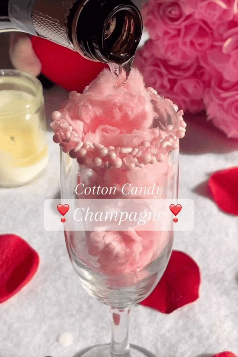 Cotton candy champagne cocktail with pink sugar rim