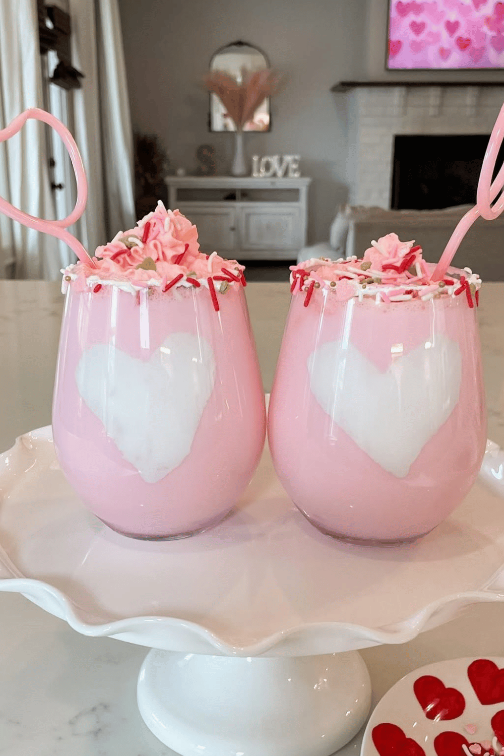 Pink milk drink with marshmallow fluff heart topping
