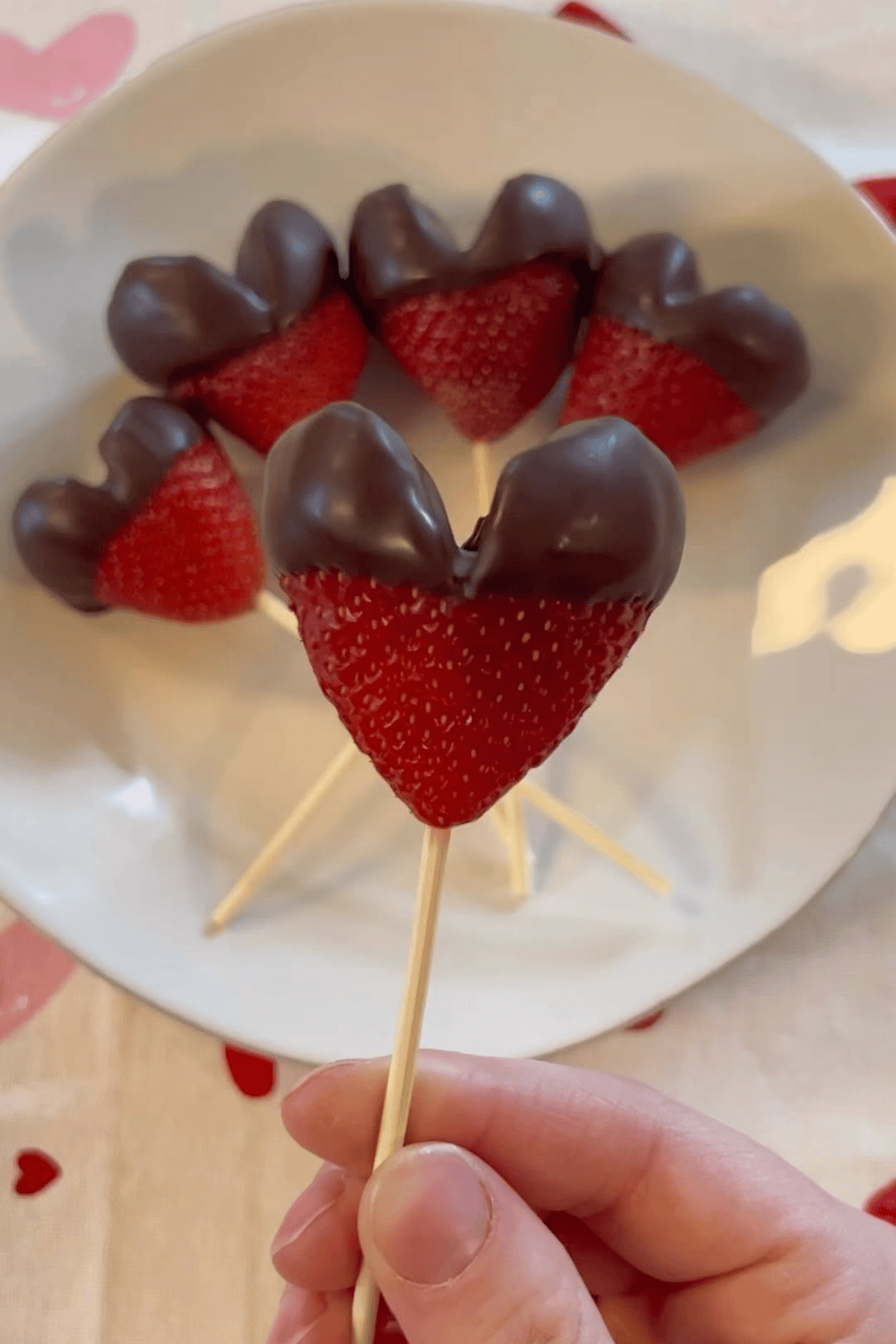 Chocolate-dipped strawberry pops served as a Galentine’s party dessert