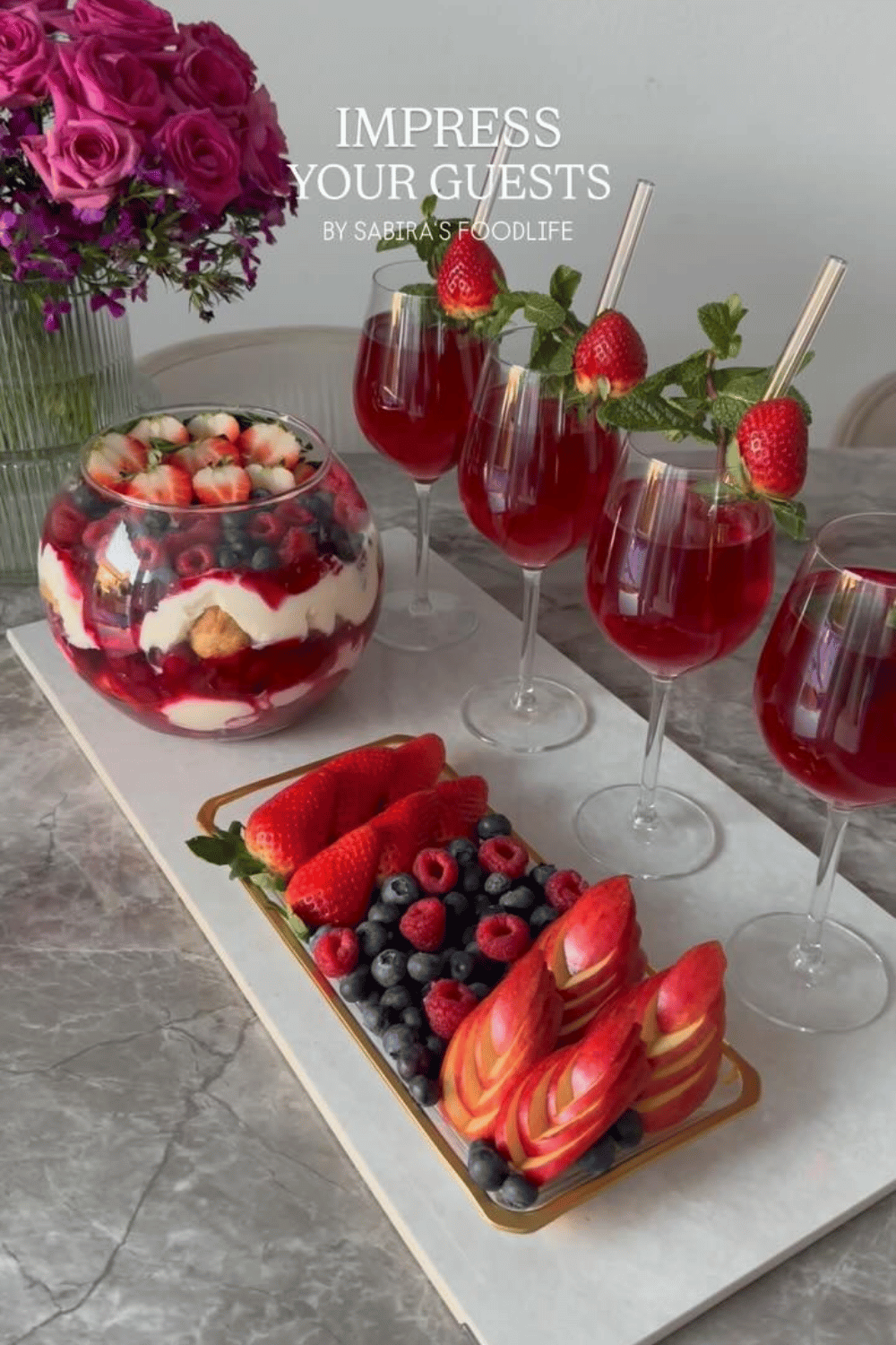 Berry dessert board with layered trifle and Valentine’s drinks