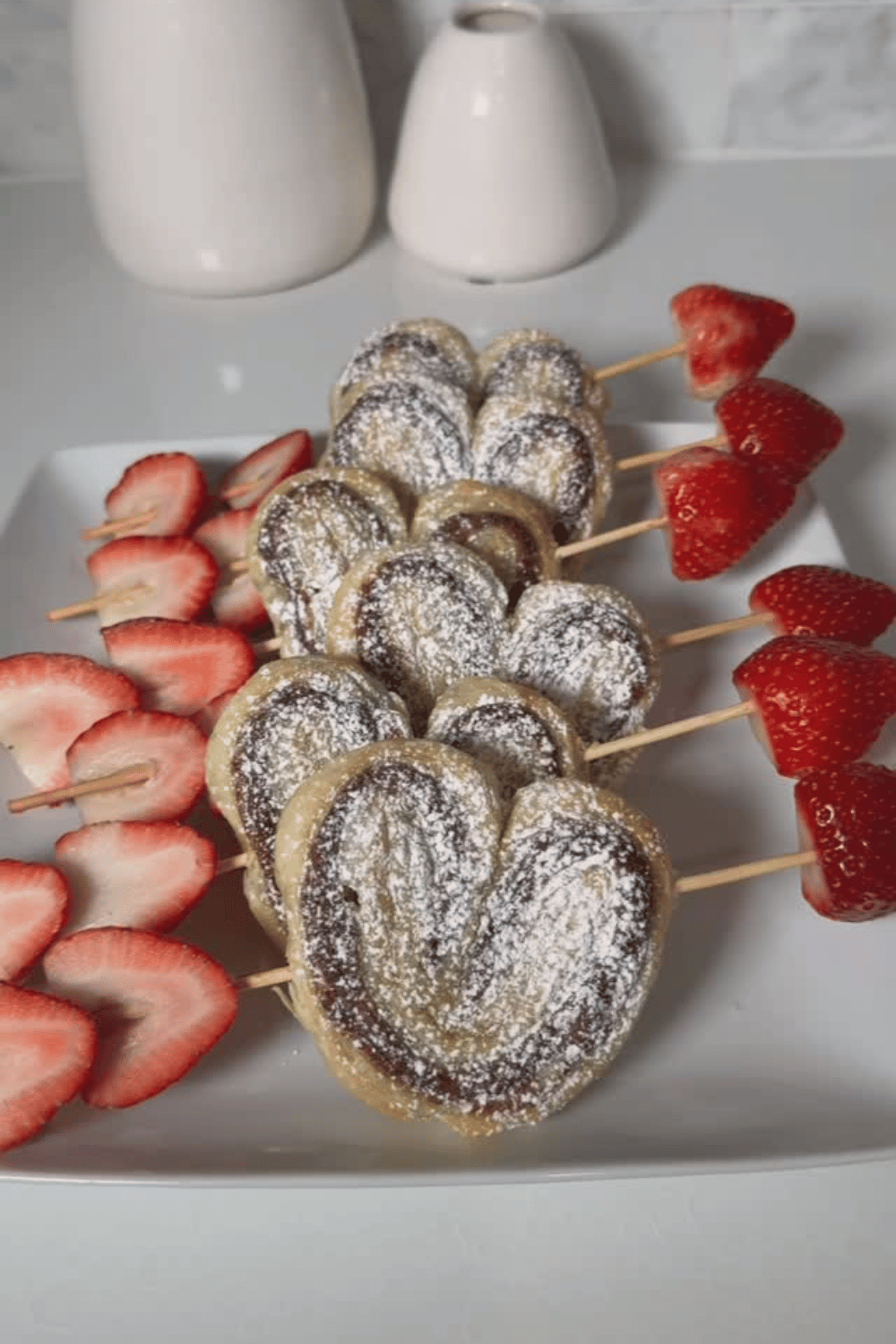 Heart-shaped pastry pops with strawberries