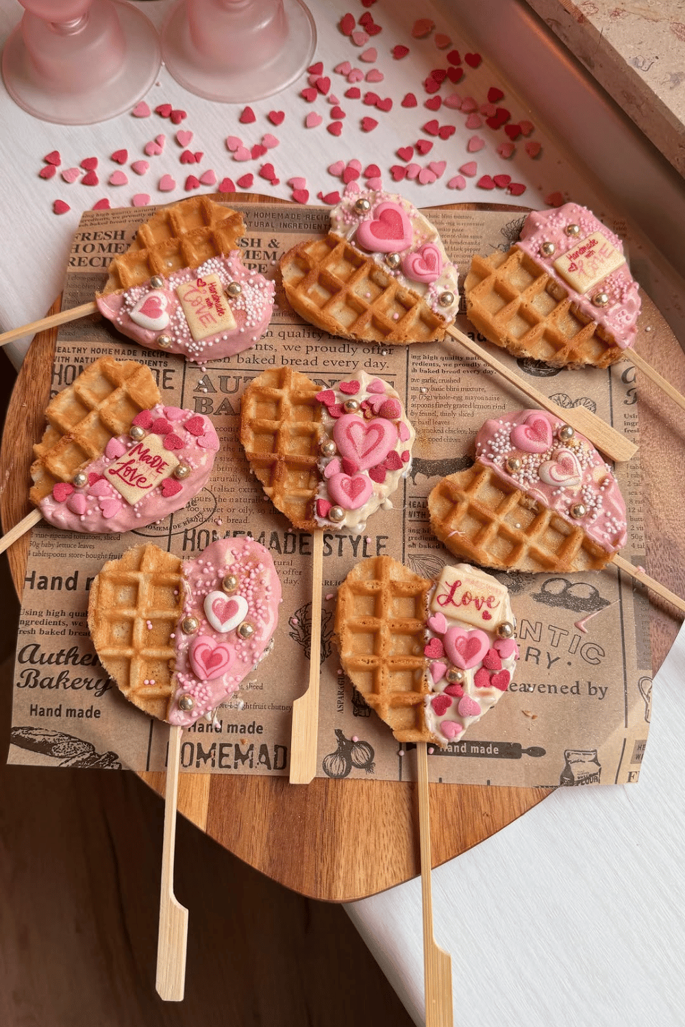 Valentine waffle pops decorated with pink frosting