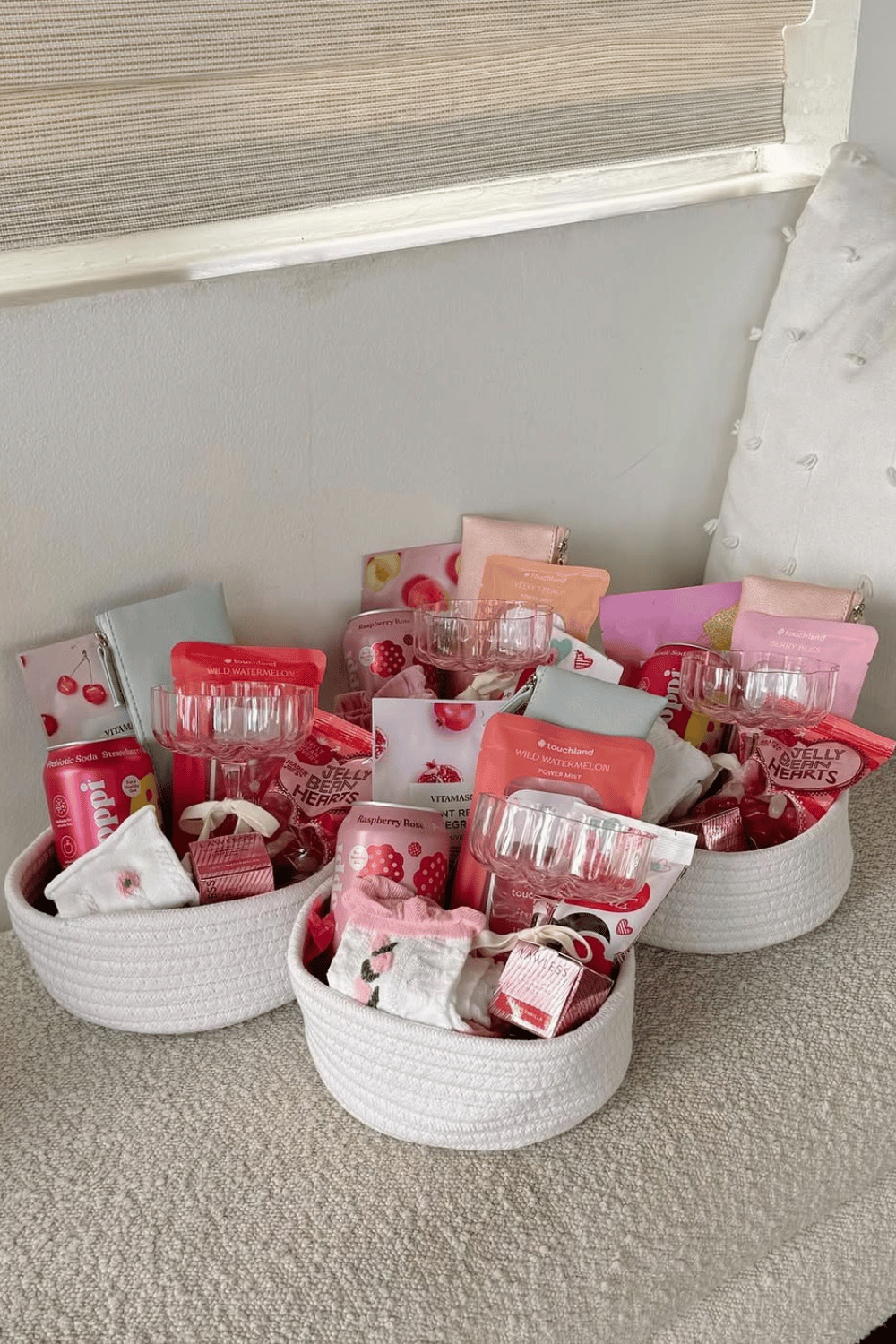 Galentine’s gift baskets with self-care items and pink packaging