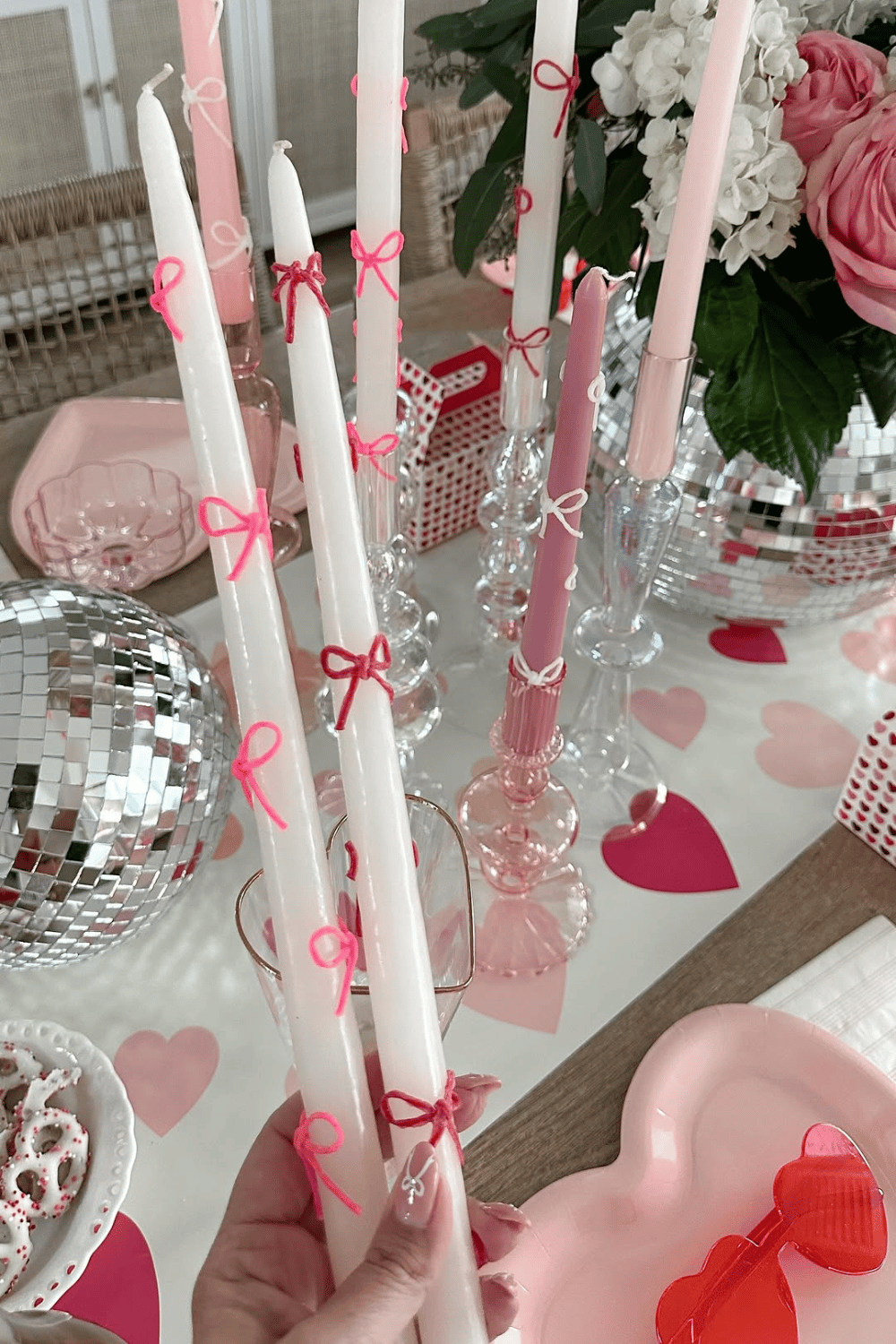 DIY galentine’s candles with pink bows and heart decor