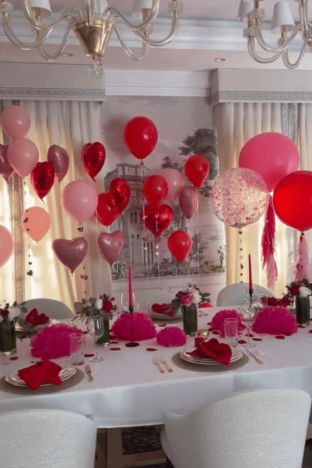 Galentine’s party table decorated with heart balloons and pink accents