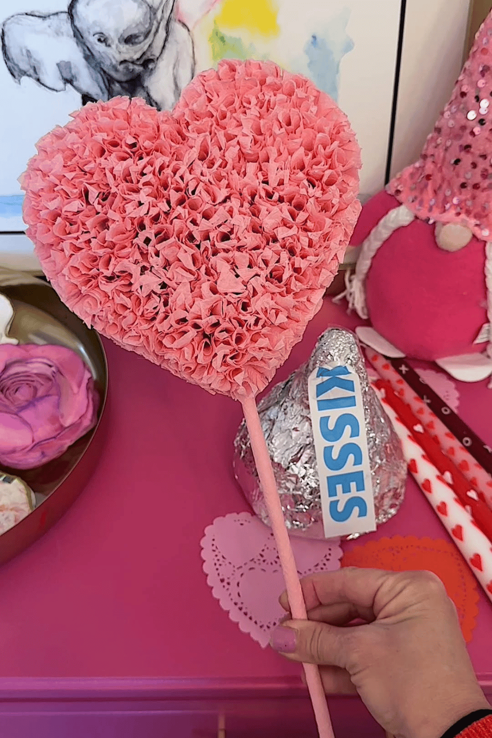 Tissue paper bow wall decor for galentine’s party