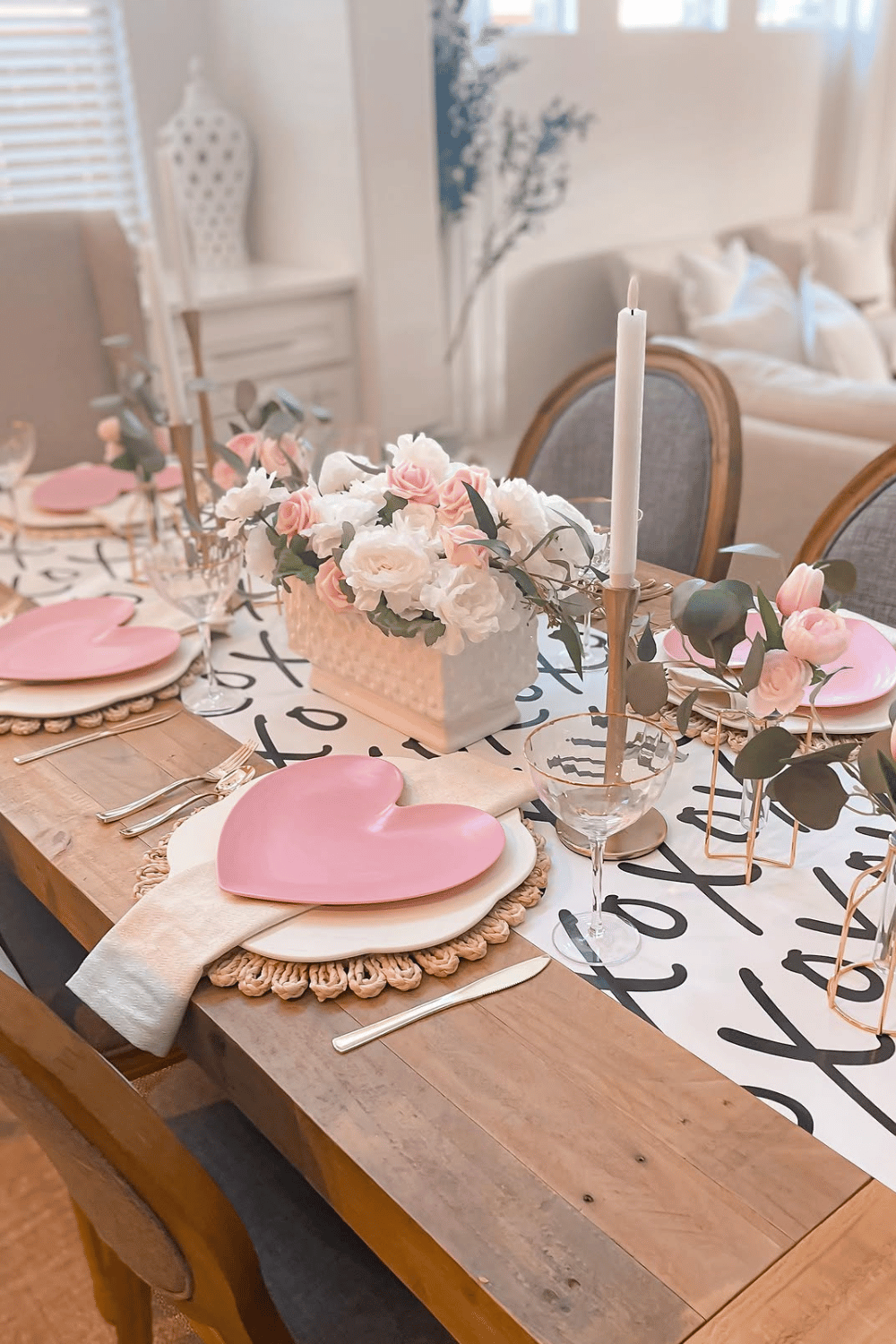 Galentine’s table with heart-shaped plates, soft florals, and neutral table linens